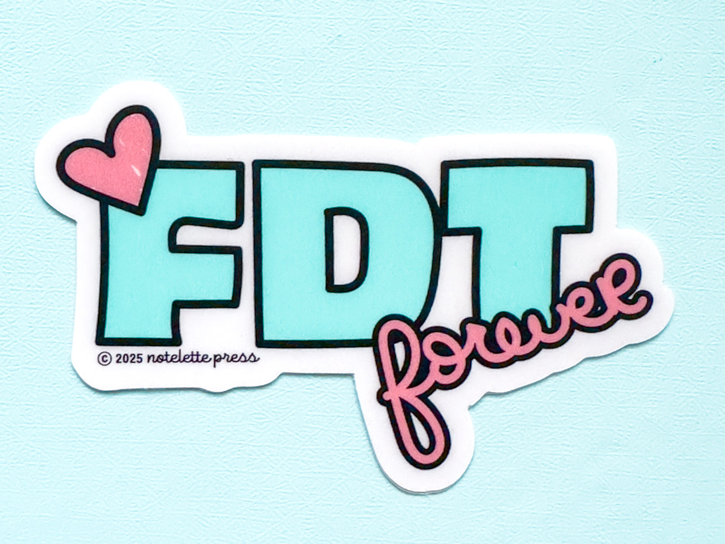 Mint and pink vinyl sticker reads “FDT forever,” short for Freedom, Democracy, Truth; pro democracy decal for laptops and water bottles.