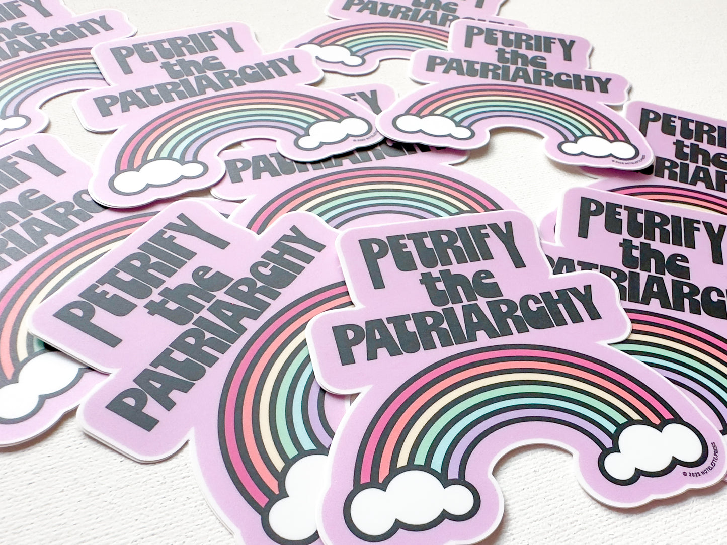 Stickers with rainbow design and text 'Petriphy the Patriarchy' on a white background