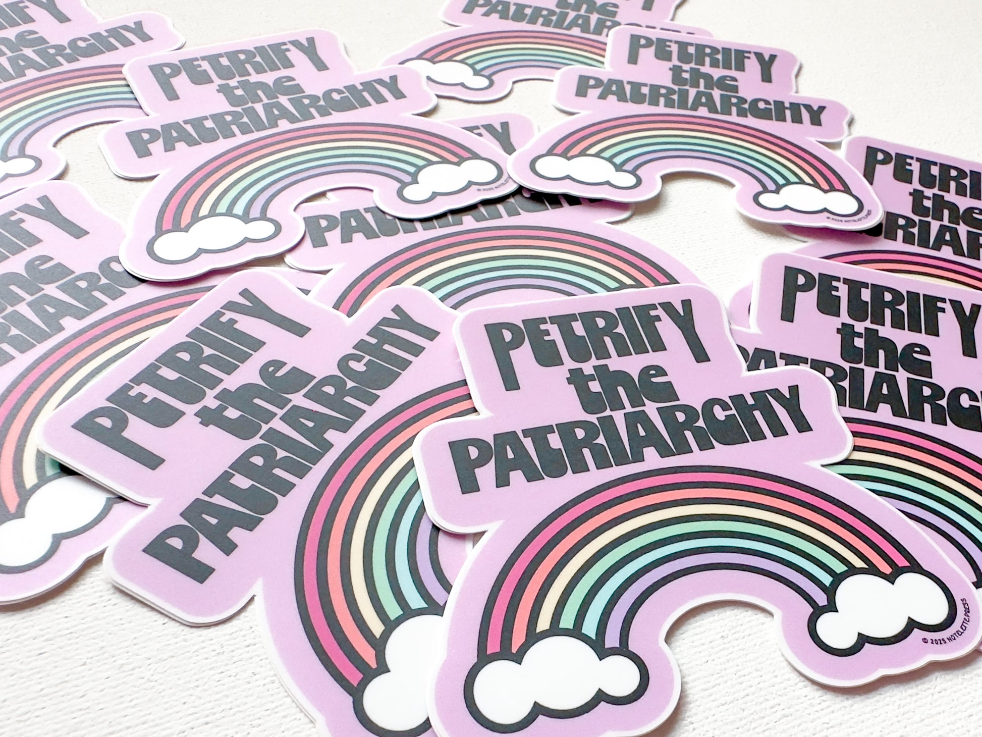 Stickers with rainbow design and text 'Petriphy the Patriarchy' on a white background